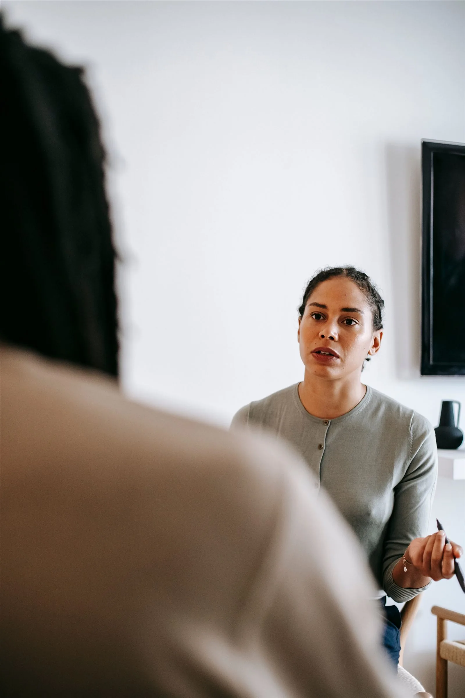 Counsellor speaking with a client about gambling-related harm
