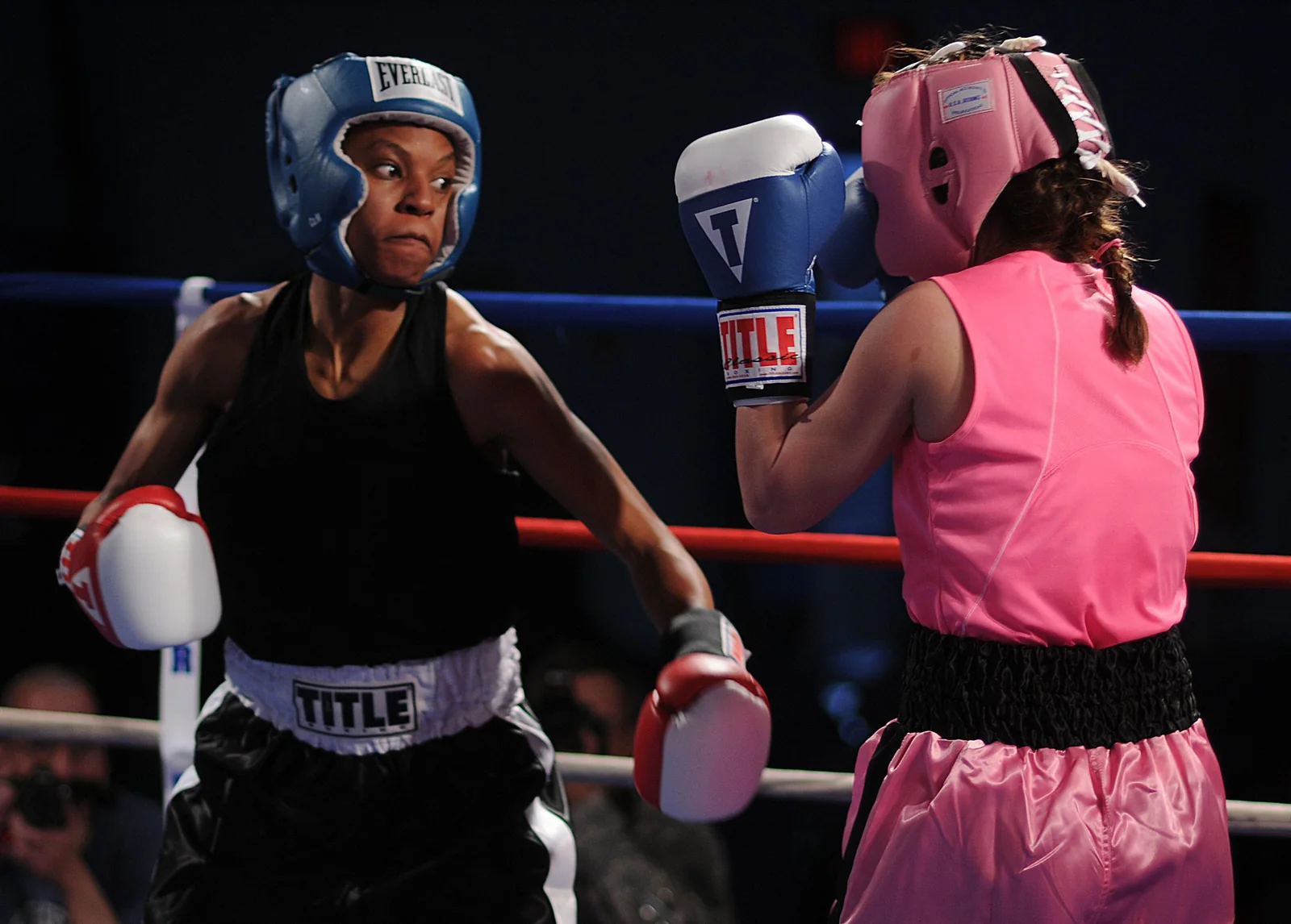 Two adult boxers competing during an exhibition match