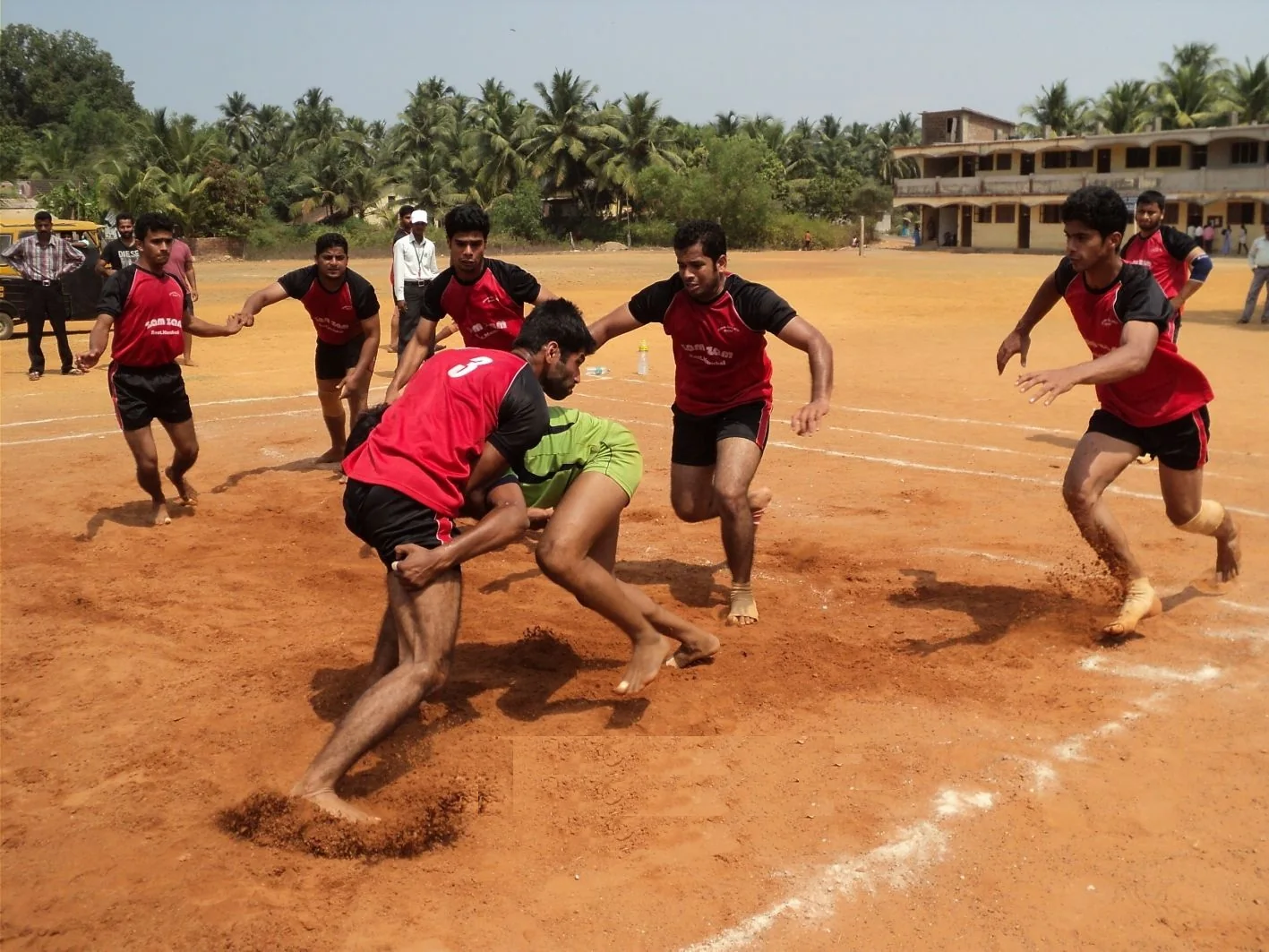 Kabaddi players competing on an outdoor court in India