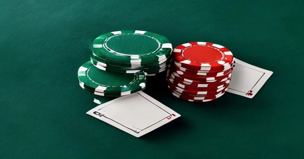 Playing cards and chips on a green casino table